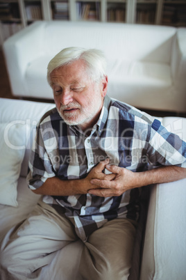 Senior man suffering from chest pain