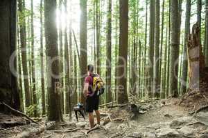 Man standing in countryside forest