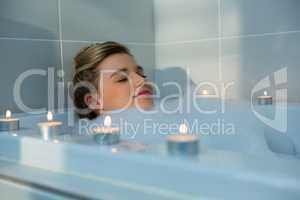 Woman taking bath in bathtub