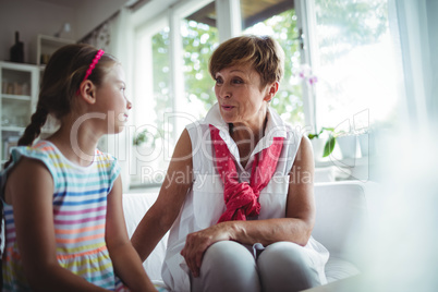 Senior woman and her granddaughter interacting with each other