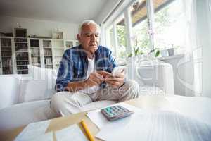 Senior man using mobile phone