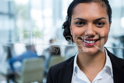 Smiling businesswoman in office