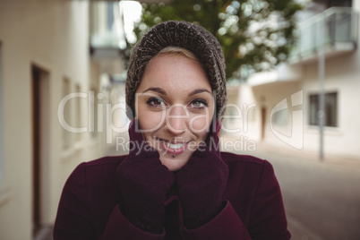 Beautiful woman posing with warm clothing