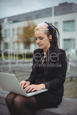 Businesswoman using laptop