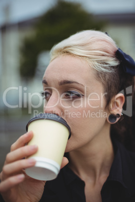 Close-up of businesswoman having coffee Close-up of businesswoman having coffee