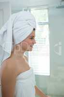 Woman in a bathrobe with a towel on her head