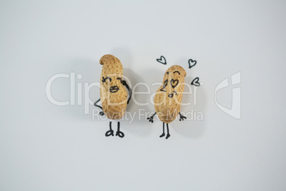 Peanut figurine as a couple standing together