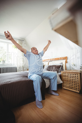 Senior man yawning on bed Senior man yawning on bed