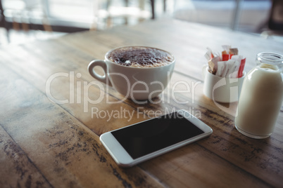 Woman standing with coffee cup