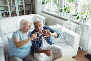 Senior couple taking a photo from mobile phone