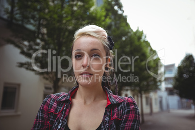 Portrait of woman standing in street