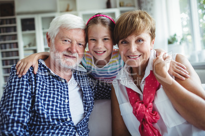 Grandparents with her grand daughter at home