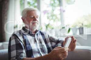 Senior man using mobile phone