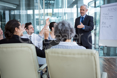 Businessman interacting with coworkers