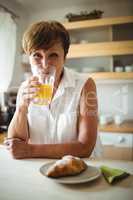 Senior woman having breakfast