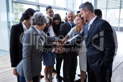 Businesspeople with hand stacked