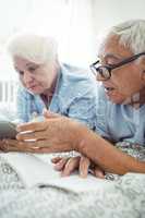 Senior couple interacting with each other on bed