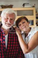 Senior couple smiling in kitchen