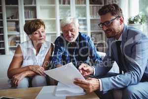 Senior couple planning their investments with financial advisor