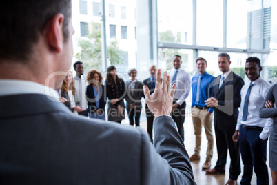 Businessman interacting with colleagues