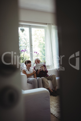 Senior couple using digital tablet