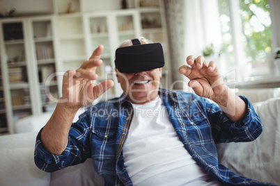 Senior man wearing virtual glasses