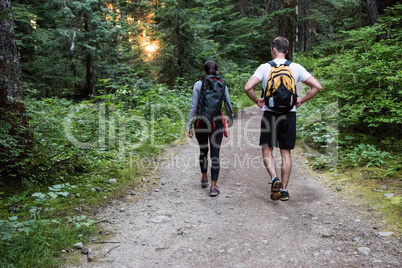 Couple walking on a dirt track in countryside