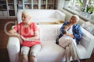 Upset senior couple ignoring each other