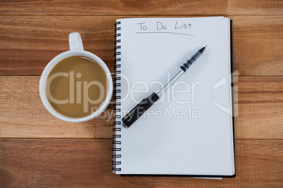 Cup of tea with diary and pen