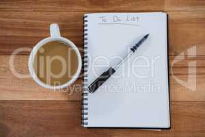 Cup of tea with diary and pen