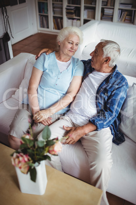 Senior couple sitting and interacting with each other