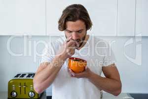 Man having breakfast in kitchen