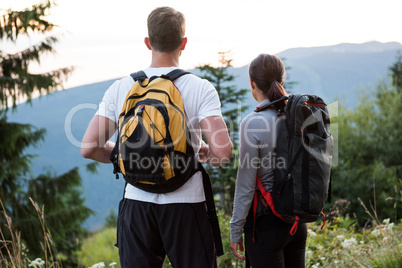 Couple standing and looking at a view