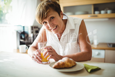 Senior woman having breakfast