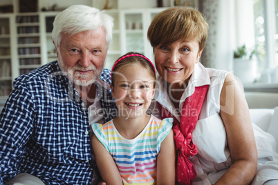 Grandparents with her grand daughter at home
