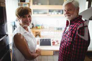 Senior couple using digital tablet