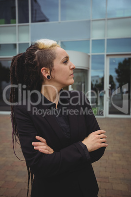 Businesswoman standing with arms crossed