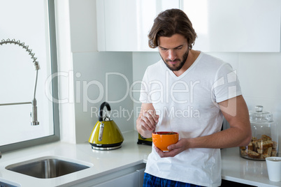 Man having breakfast in kitchen