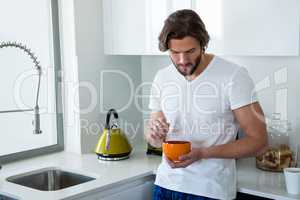 Man having breakfast in kitchen