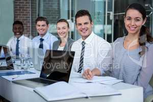 Businesspeople sitting in conference room