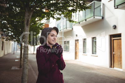 Woman smiling and holding a cup of coffee