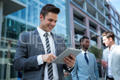 Businessman using digital tablet in the office building Businessman using digital tablet in the office building