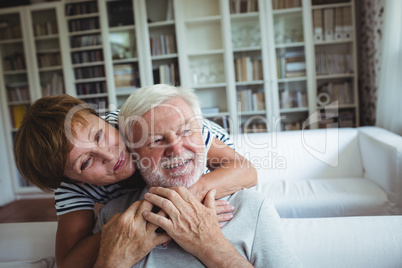 Senior woman embracing man