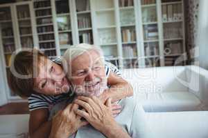 Senior woman embracing man