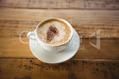 Close-up of coffee cup with saucer