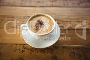 Close-up of coffee cup with saucer