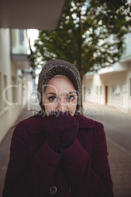 Woman shivering with cold