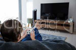 Man playing video games in living room