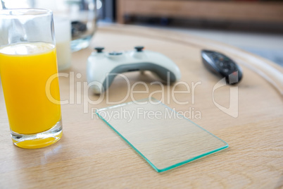 Juice with a piece of glass on a table