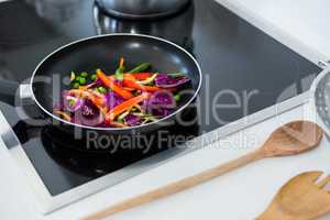 Food on a induction cooktop in kitchen